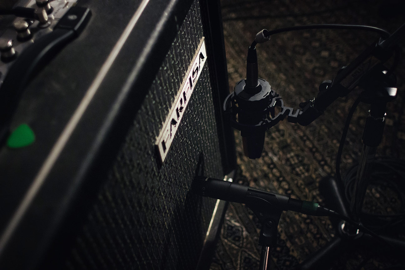 A guitar amp with mics in various positions