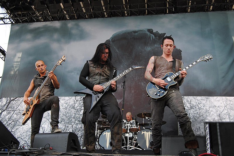 Trivium members performing in 2013